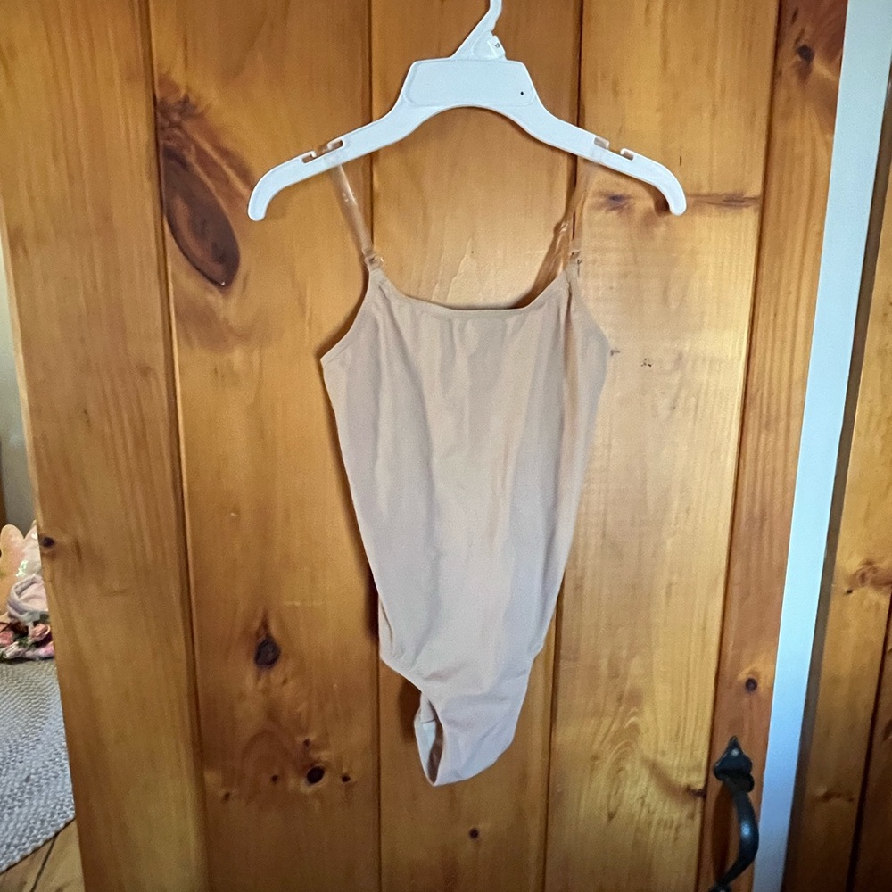 Girls nude color bodysuit.